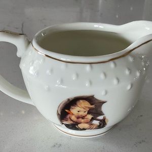 M.J. Hummel “Umbrella Boy” Creamer. Marked The Danbury Mint. No chips or cracks